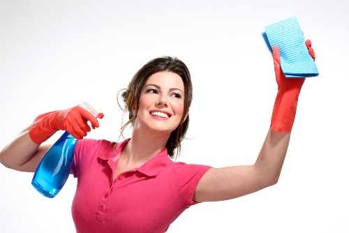 Professional cleaner reviewing payment and invoice information